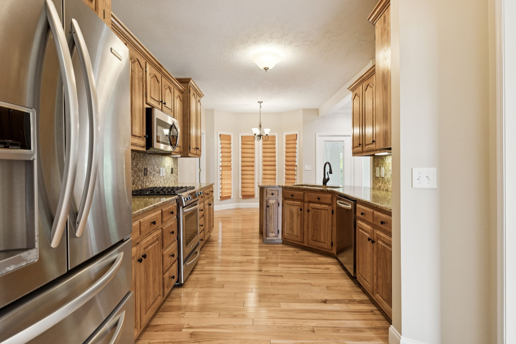 314 West Main Street Alexandria, TN 37012 - Photo 25 of 53 a kitchen with stainless steel appliances granite countertop a refrigerator and a stove