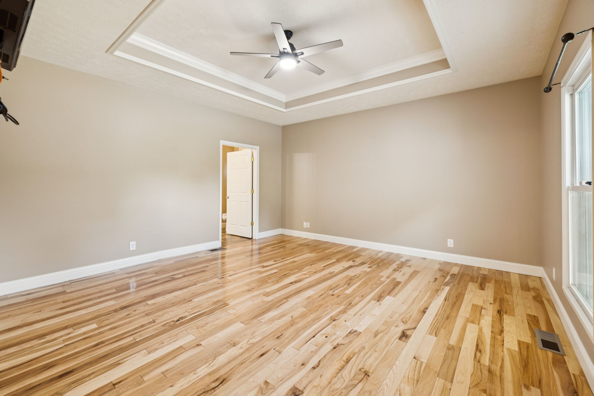 314 West Main Street Alexandria, TN 37012 - Photo 27 of 53 an empty room with wooden floor and a ceiling fan