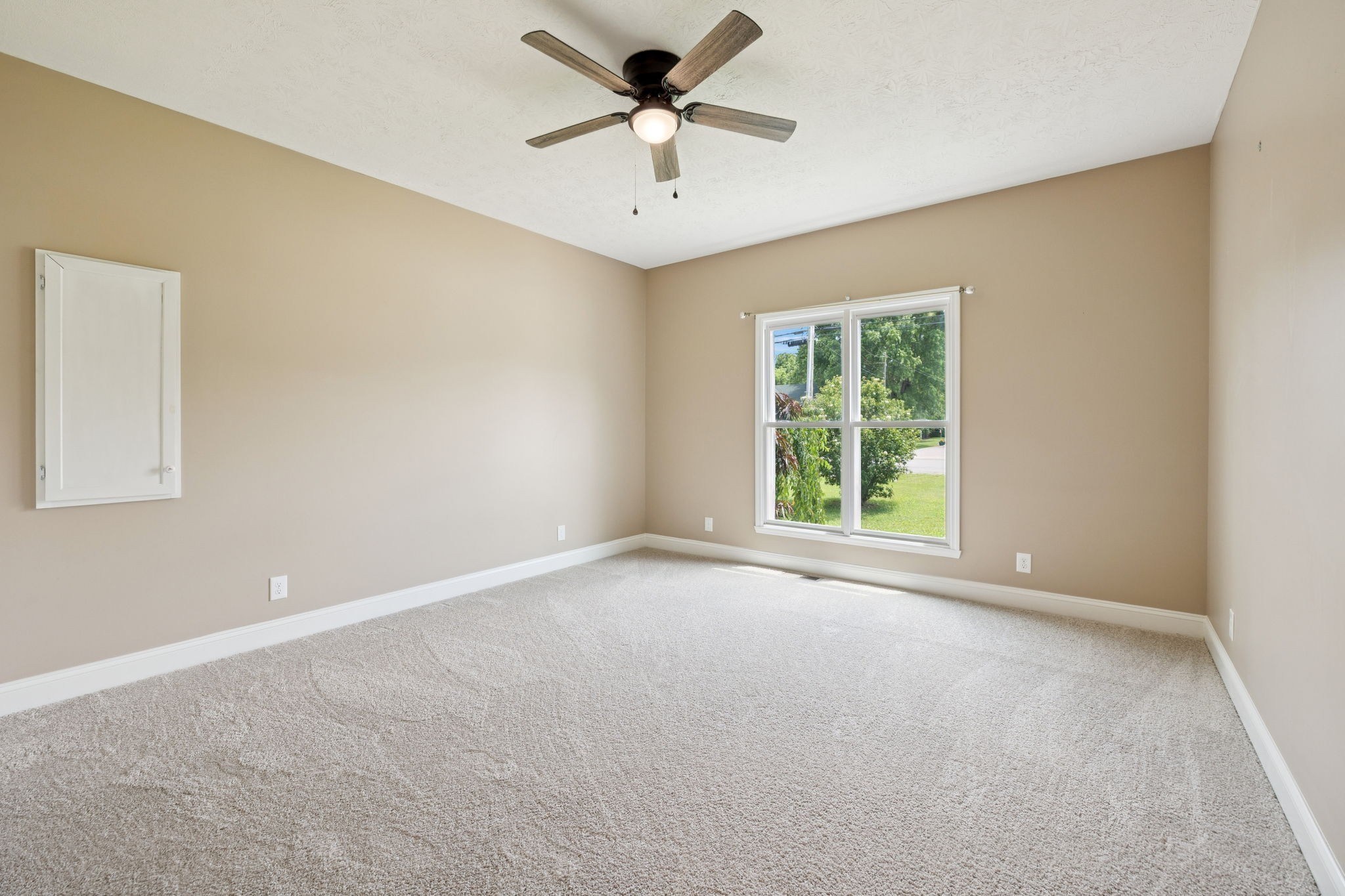 314 West Main Street Alexandria, TN 37012 - Photo 39 of 53 a view of a livingroom with a window and a ceiling fan