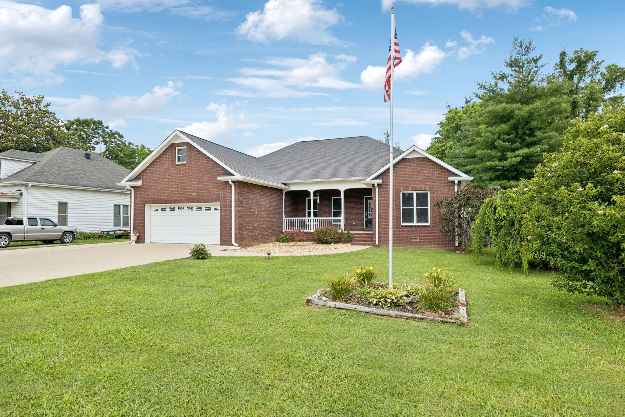 314 West Main Street Alexandria, TN 37012 - Photo 48 of 53 a front view of a house with a yard