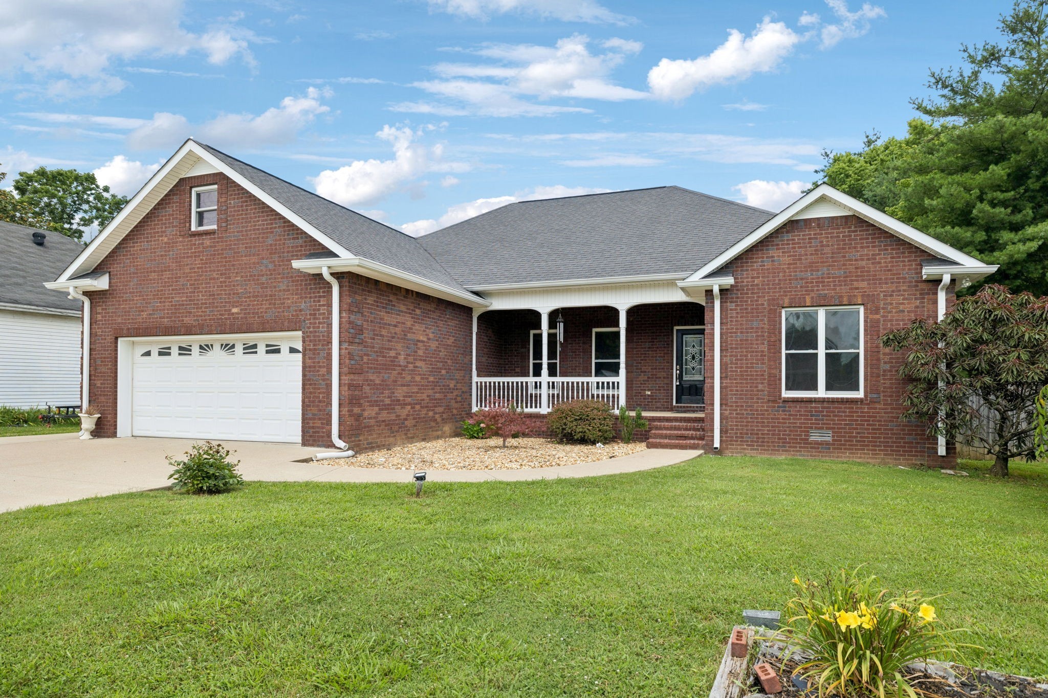314 West Main Street Alexandria, TN 37012 - Photo 51 of 53 a front view of a house with a garden and yard