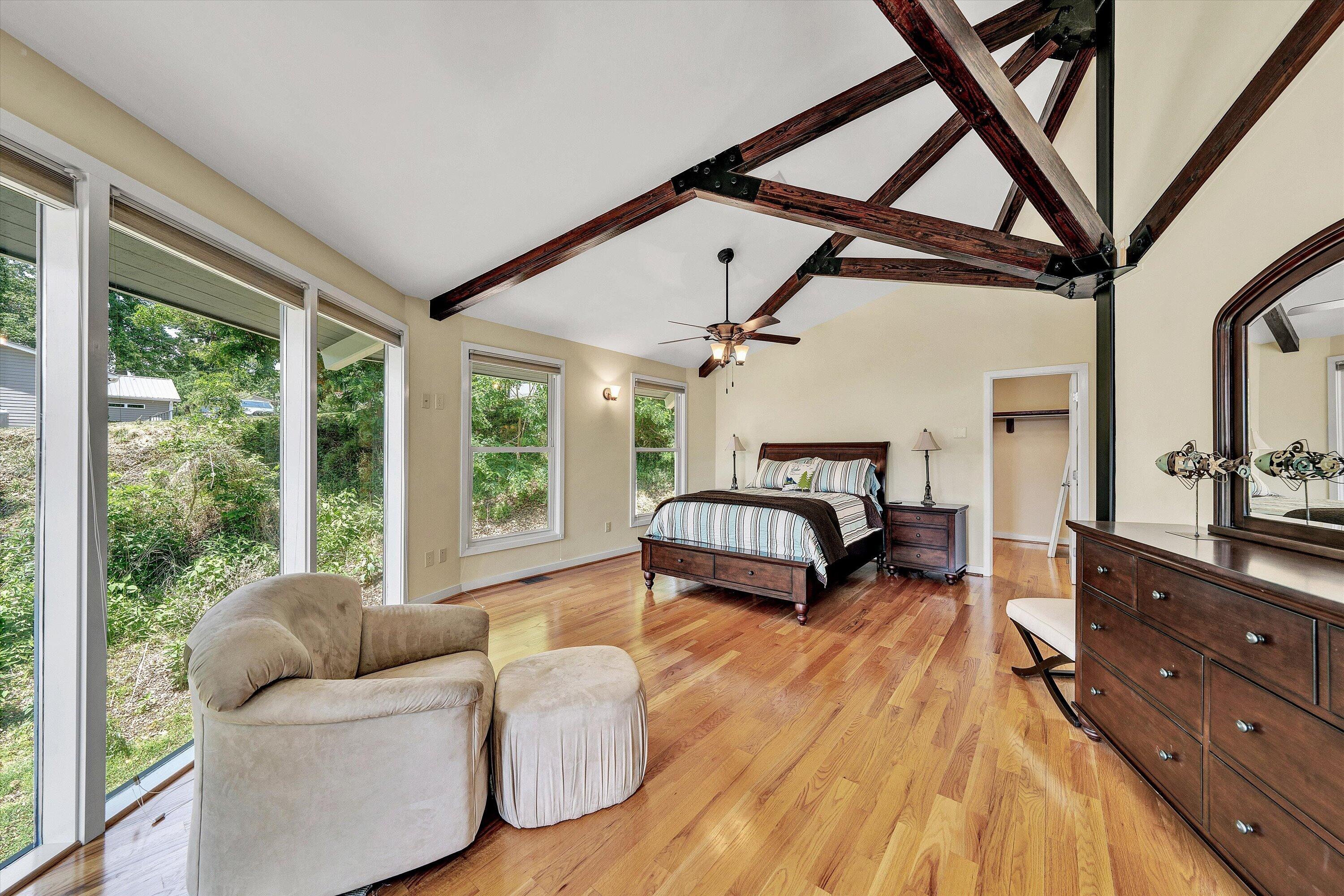 207 Winding Way Union Hall, VA 24176 - Photo 23 of 60 a bedroom with furniture and large windows