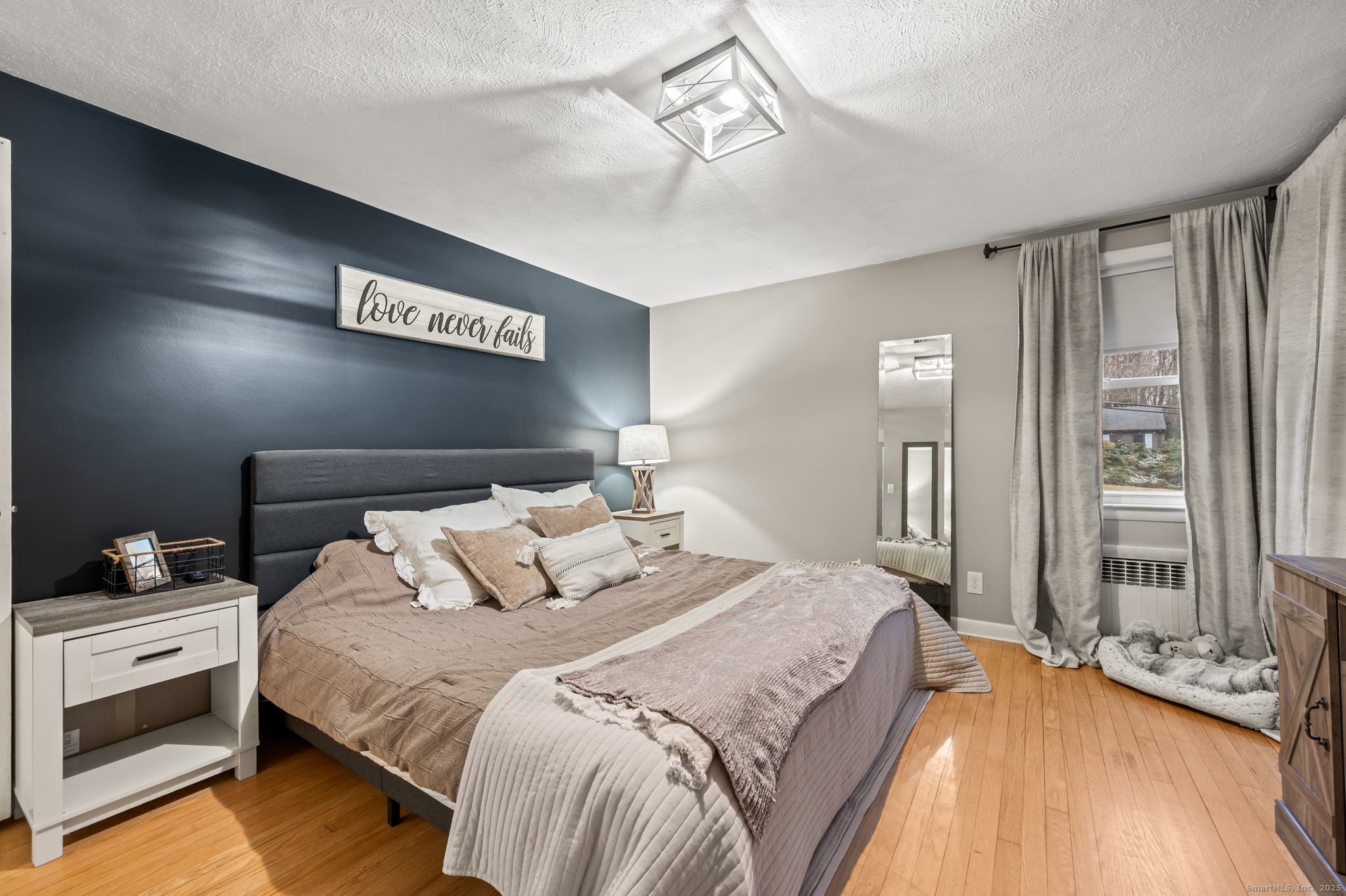 24 William Street Portland, CT 06480 - Photo 13 of 35 a bedroom with bed and window