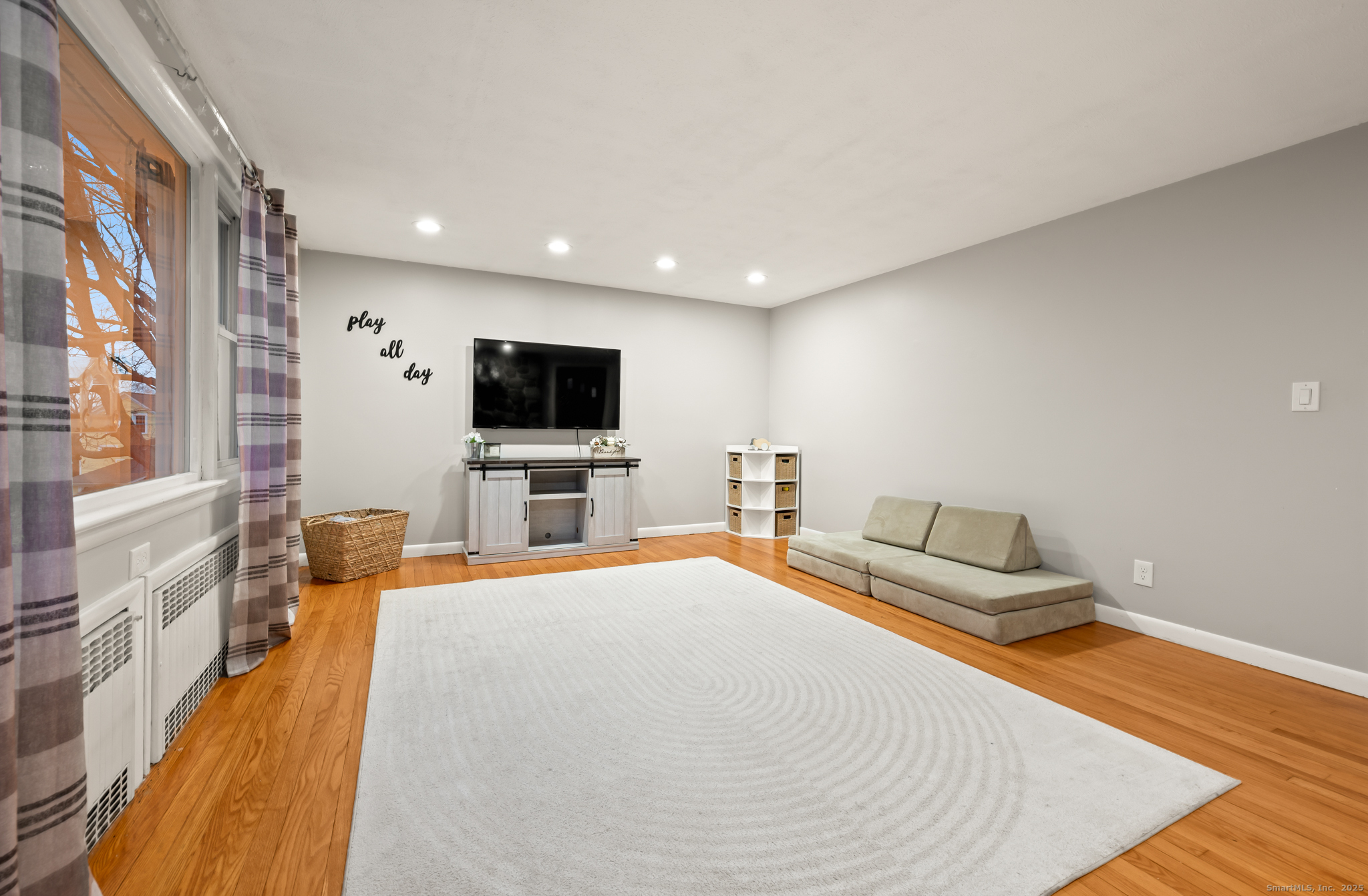 24 William Street Portland, CT 06480 - Photo 10 of 35 a bedroom with a bed and a flat screen tv