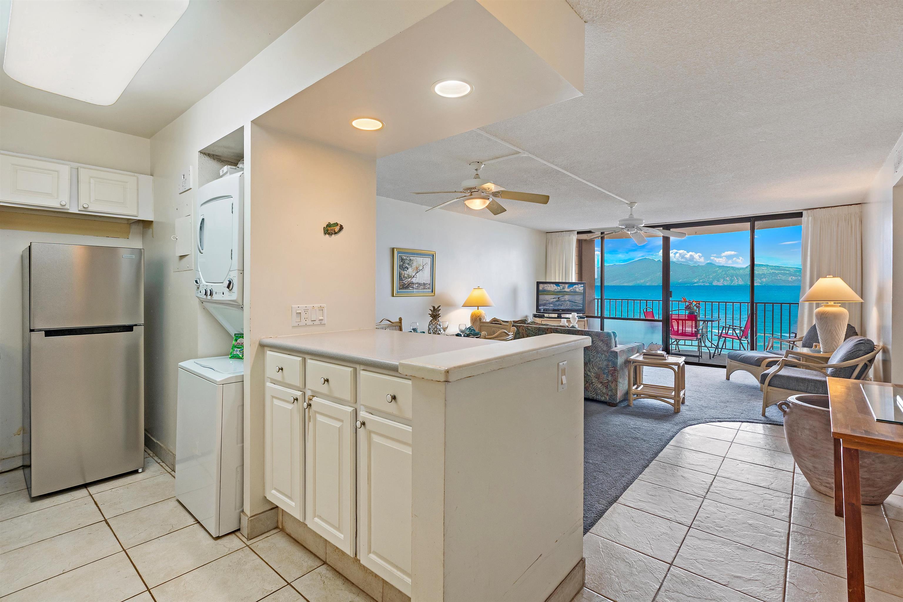 4327 Lower Honoapiilani Road, Unit 808 Lahaina, HI 96761 - Photo 11 of 35 a kitchen with a sink appliances and cabinets