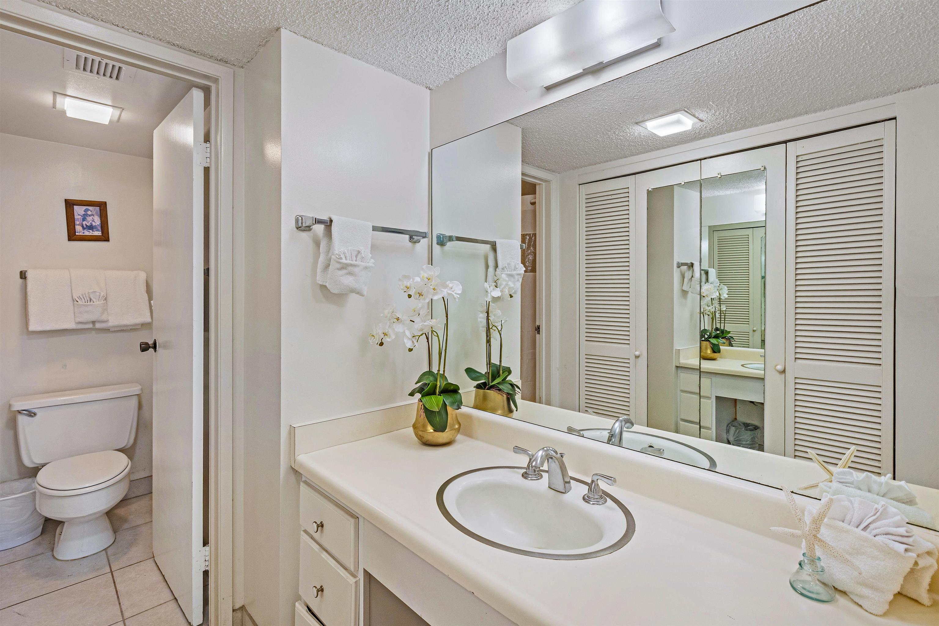 4327 Lower Honoapiilani Road, Unit 808 Lahaina, HI 96761 - Photo 21 of 35 a bathroom with a granite countertop sink toilet and shower