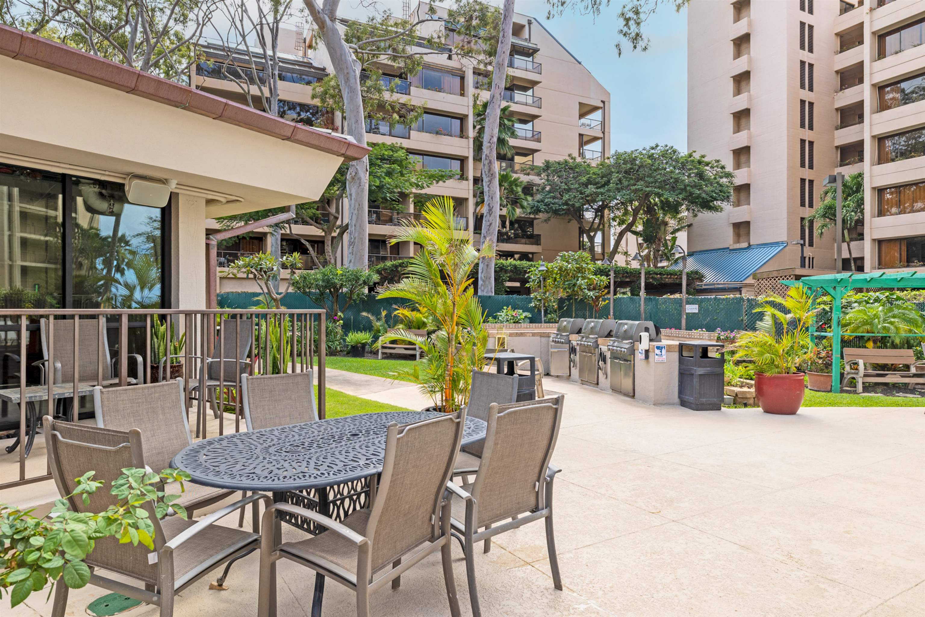 4327 Lower Honoapiilani Road, Unit 808 Lahaina, HI 96761 - Photo 34 of 35 a view of an outdoor dining space with a table and chairs
