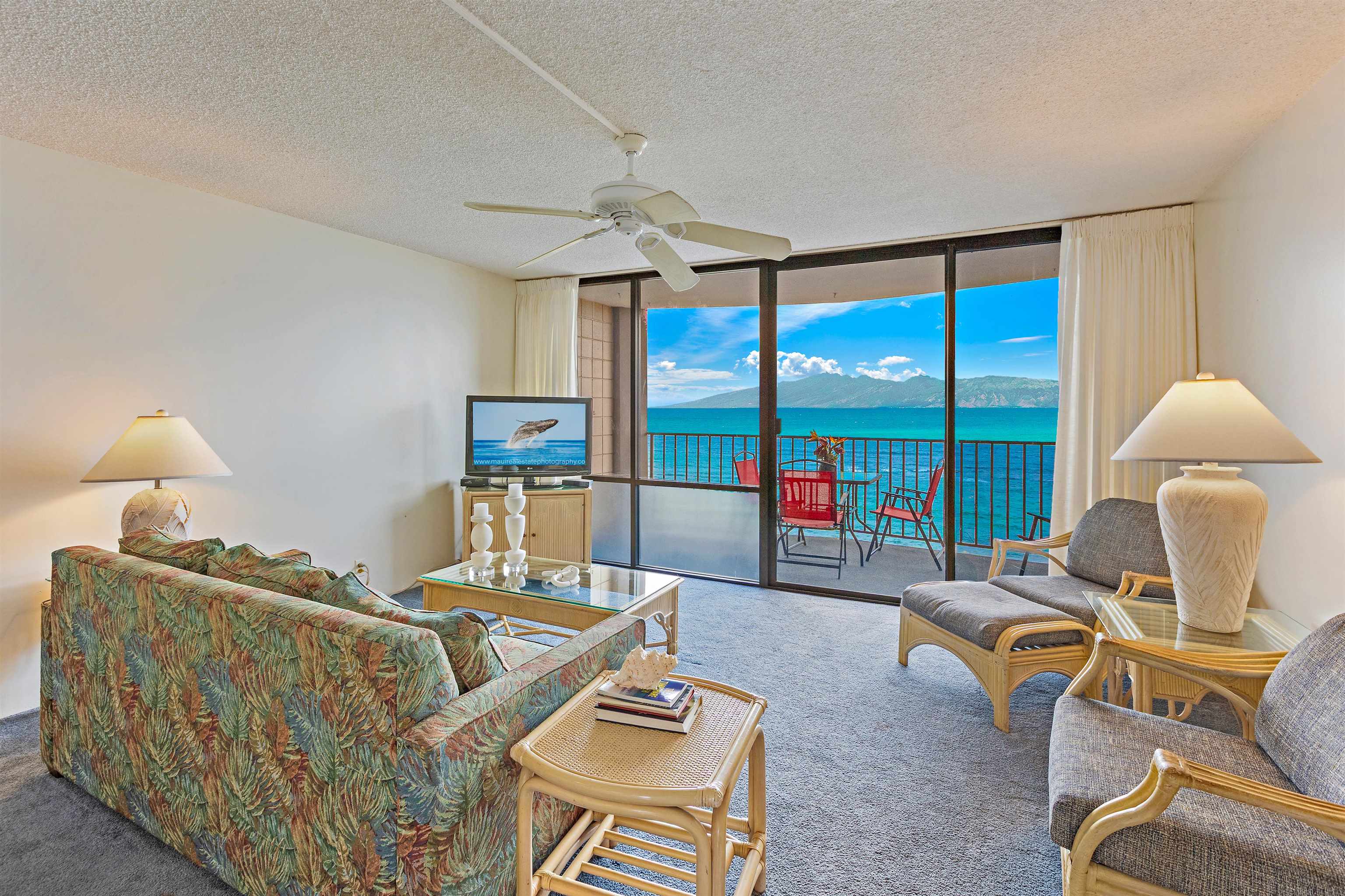 4327 Lower Honoapiilani Road, Unit 808 Lahaina, HI 96761 - Photo 4 of 35 a living room with furniture and a floor to ceiling window