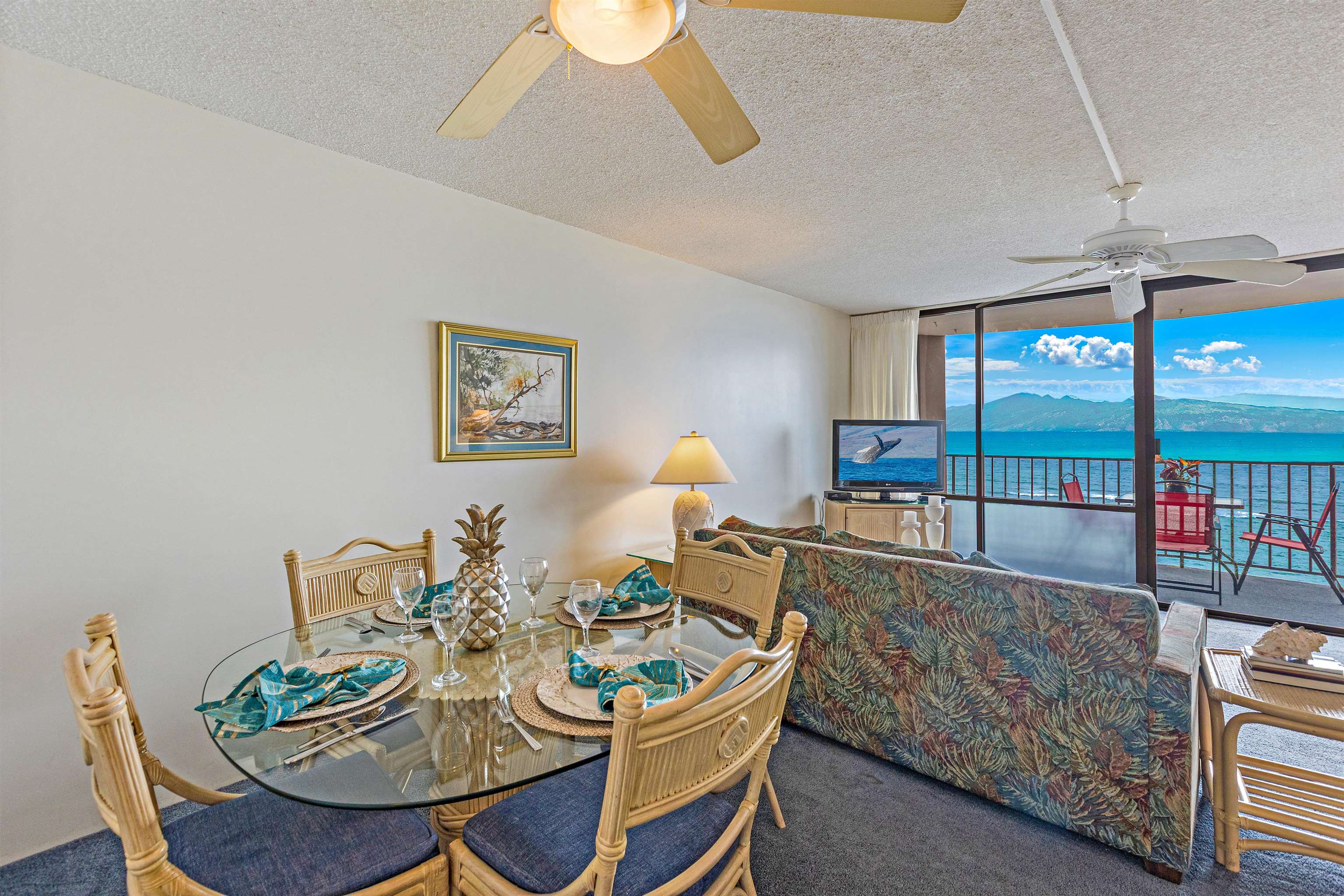 4327 Lower Honoapiilani Road, Unit 808 Lahaina, HI 96761 - Photo 6 of 35 a living room with furniture and a table