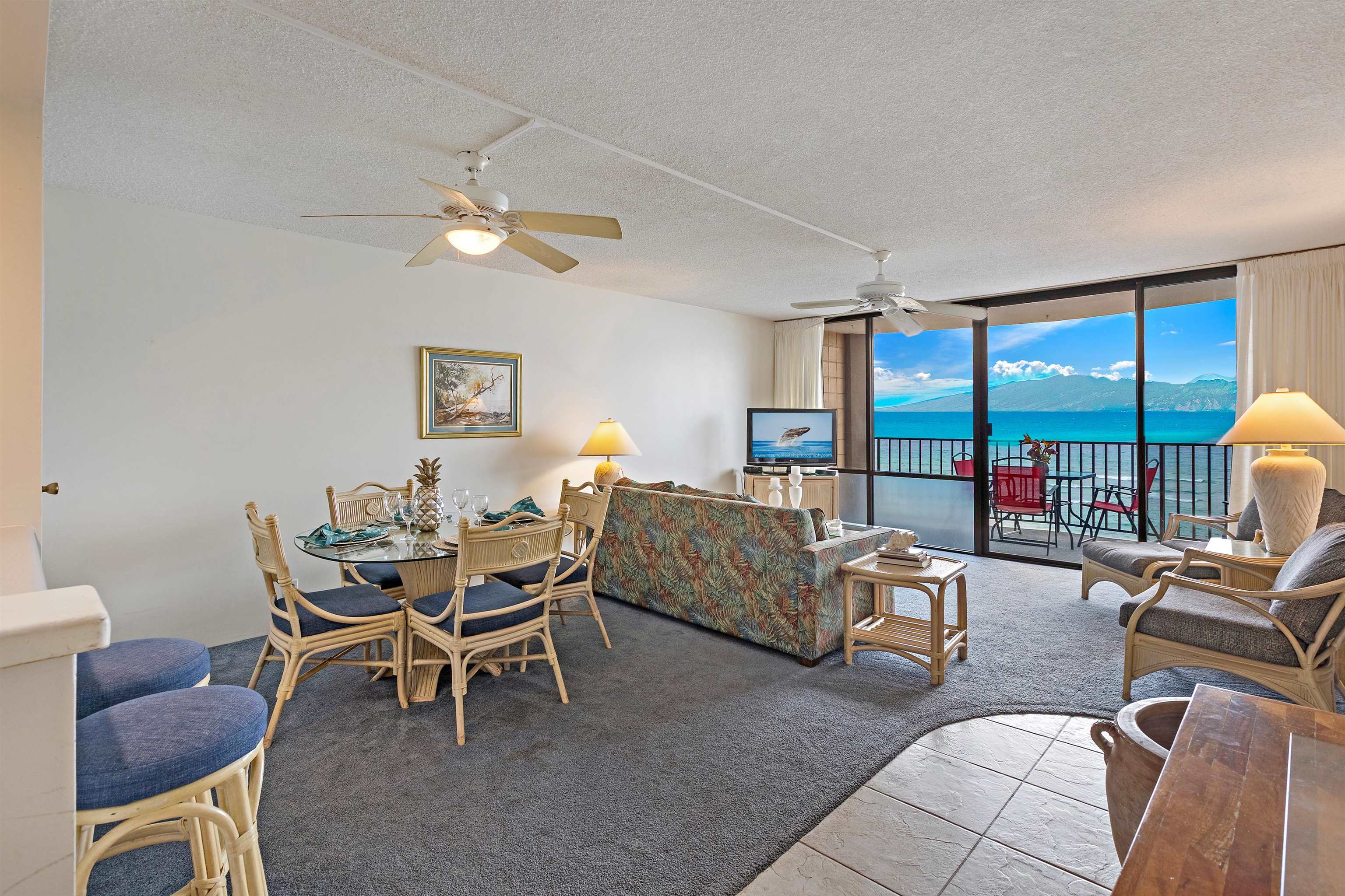 4327 Lower Honoapiilani Road, Unit 808 Lahaina, HI 96761 - Photo 7 of 35 a dining room with furniture and a large window