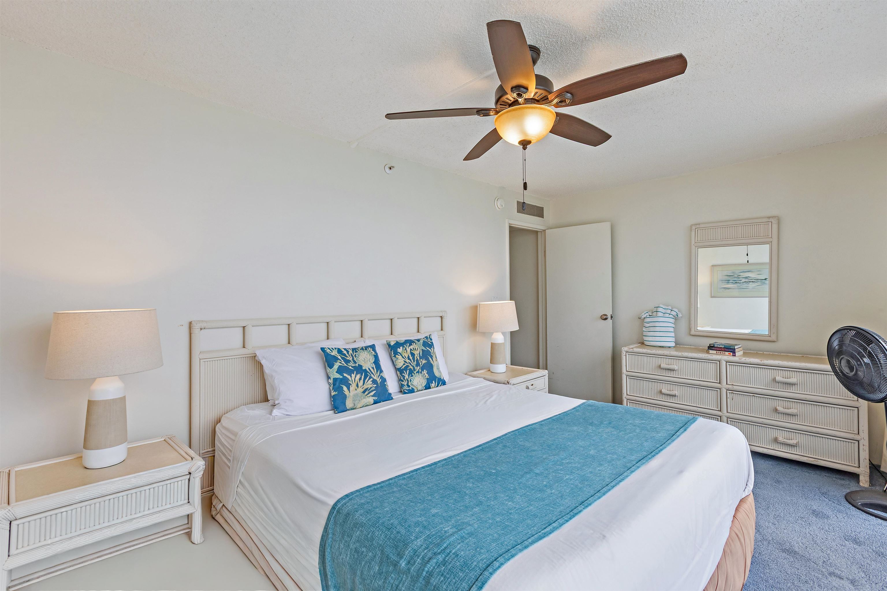 4327 Lower Honoapiilani Road, Unit 808 Lahaina, HI 96761 - Photo 10 of 35 a bedroom with a bed and dresser