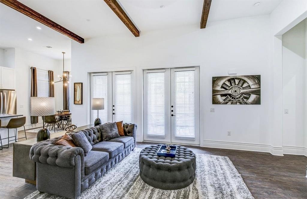 12001 Inwood Road, Unit 3701 Dallas, TX 75244 - Photo 3 of 15 Living room featuring french doors, dark hardwood / wood-style floors, and vaulted ceiling with beams