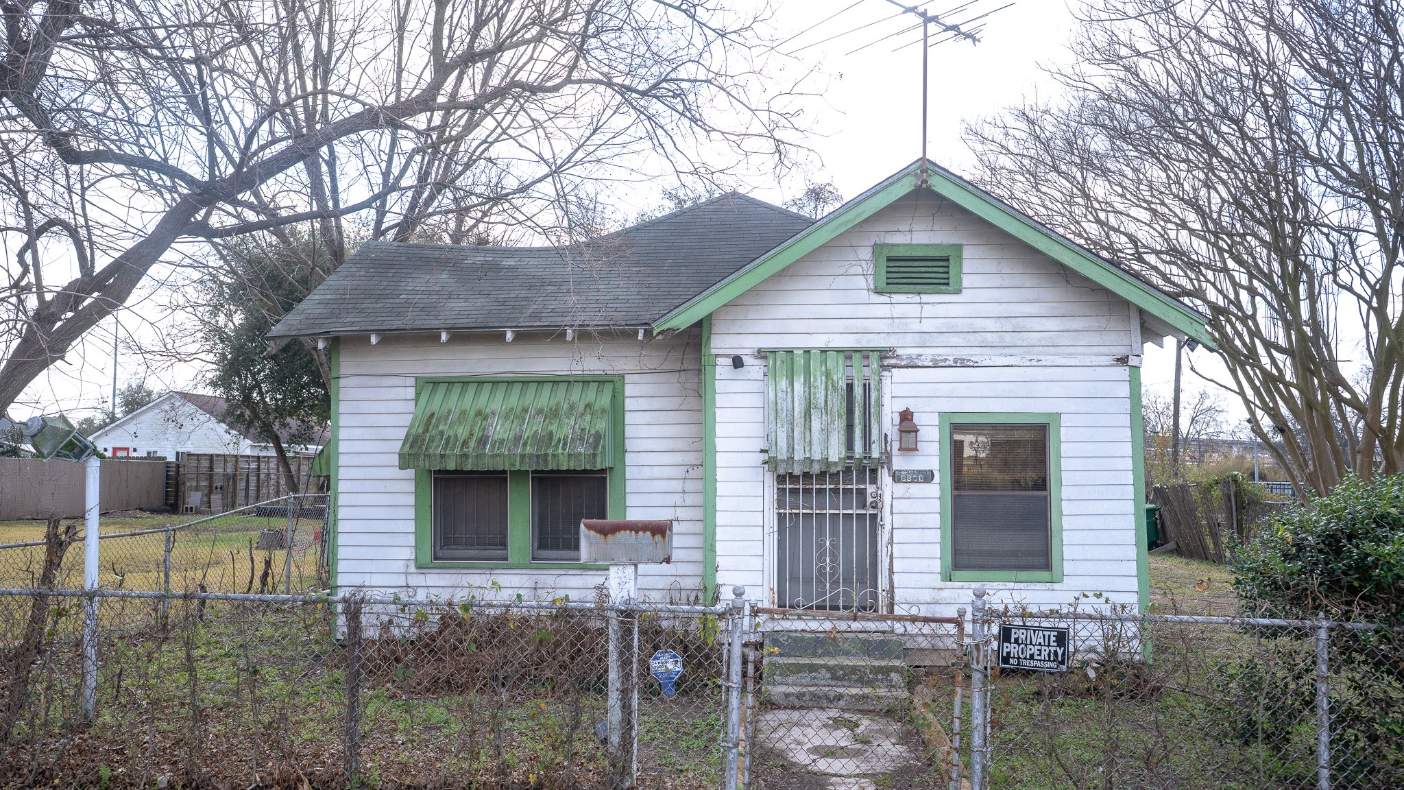 8808 Leander Street Houston, TX 77012 - Photo 3 of 12 a front view of a house with garden