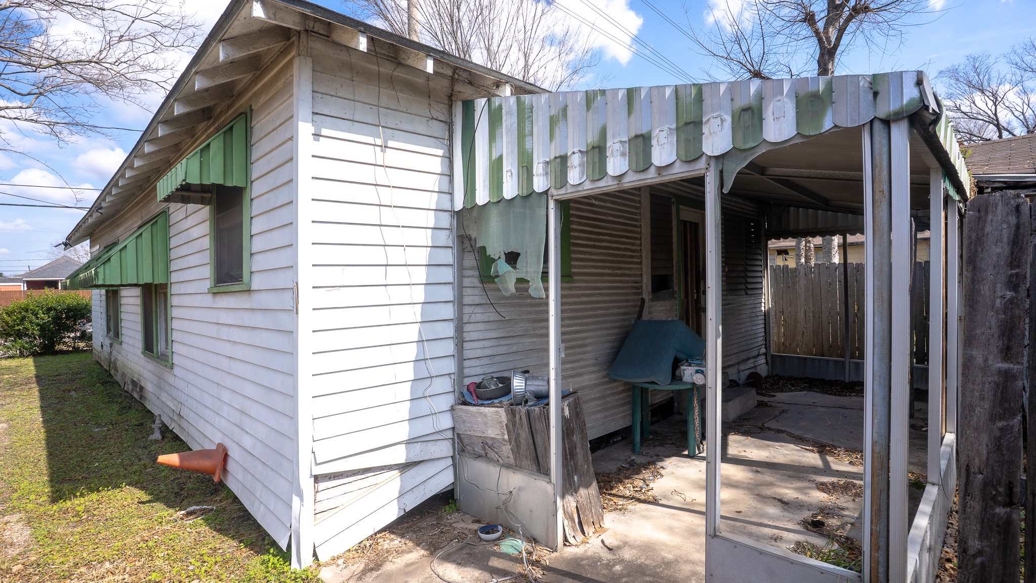 8808 Leander Street Houston, TX 77012 - Photo 6 of 12 a view of a house with a door and wooden walls