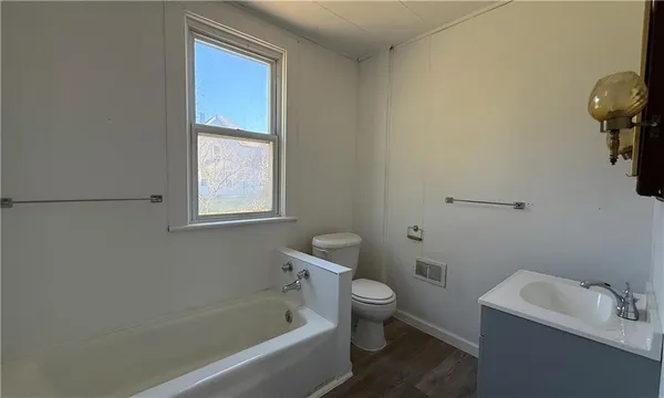a bathroom with a toilet sink and bathtub