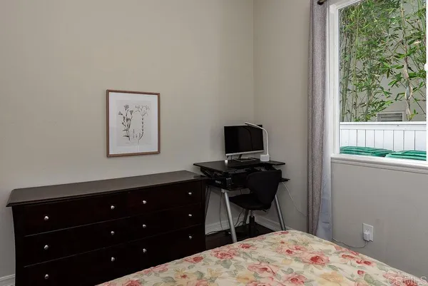 a spacious bedroom with a large bed and a fireplace