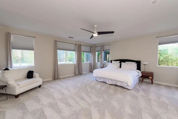 a kitchen with stainless steel appliances granite countertop a sink stove refrigerator and cabinets