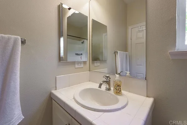 a view of a house with potted plants