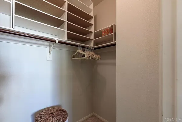 a front view of a house with a yard and a garden