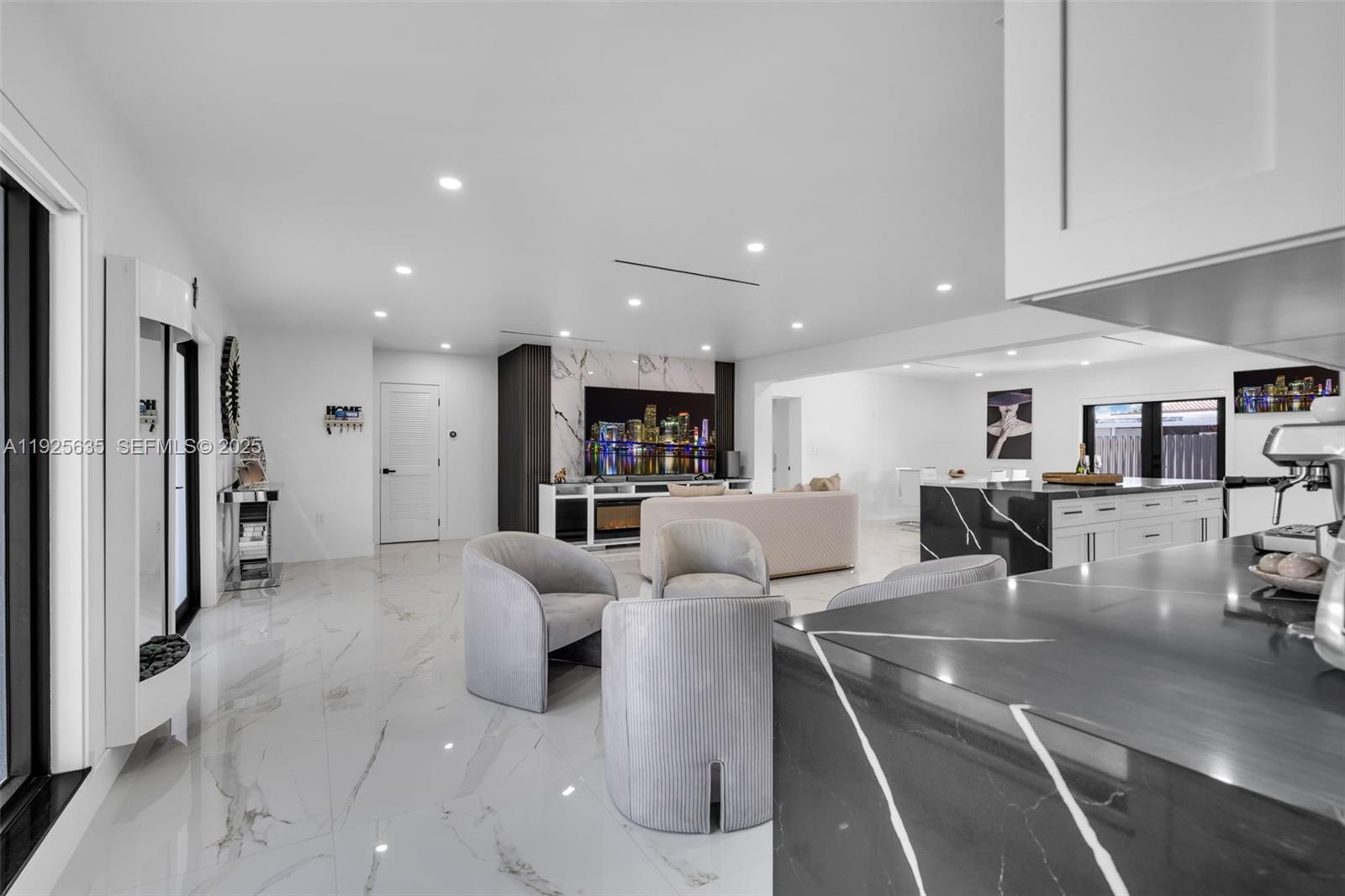 864 West 69th Place Hialeah, FL 33014 - Photo 11 of 45 a living room with furniture and kitchen view