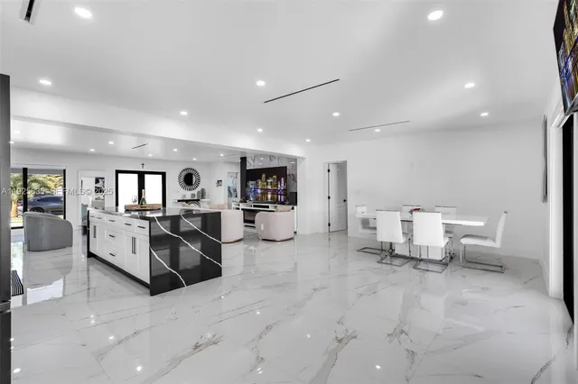 a living room with furniture and white walls