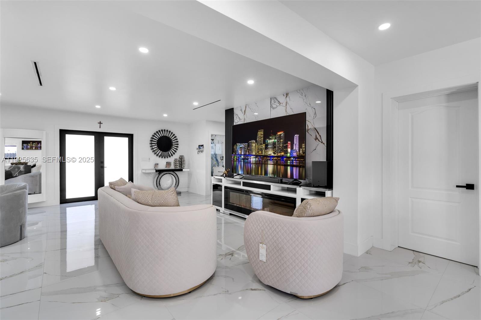 864 West 69th Place Hialeah, FL 33014 - Photo 17 of 45 a living room with furniture and a flat screen tv