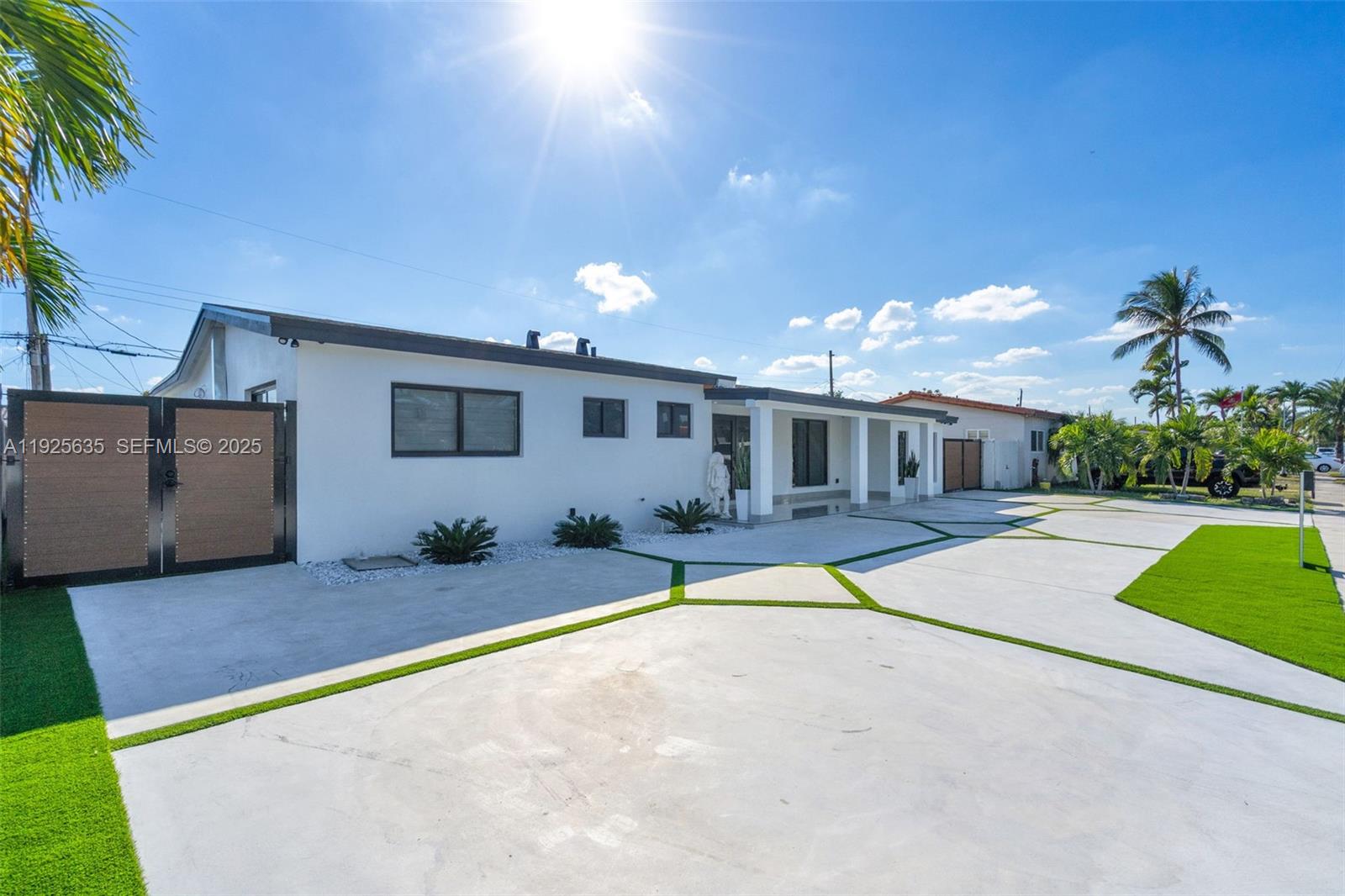 864 West 69th Place Hialeah, FL 33014 - Photo 2 of 45 a house view with a sitting space