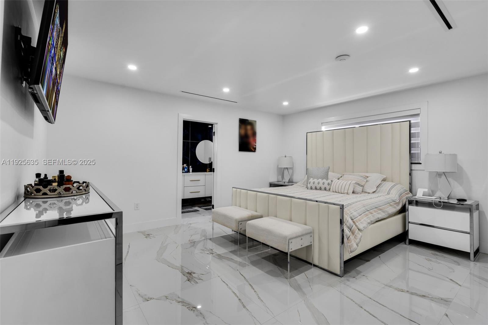 864 West 69th Place Hialeah, FL 33014 - Photo 21 of 45 a room with a bed and a flat screen tv