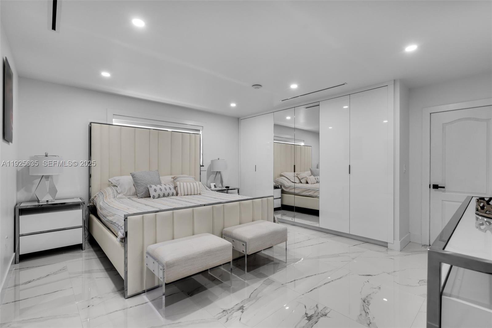 864 West 69th Place Hialeah, FL 33014 - Photo 22 of 45 a large bedroom with a bed and a couch