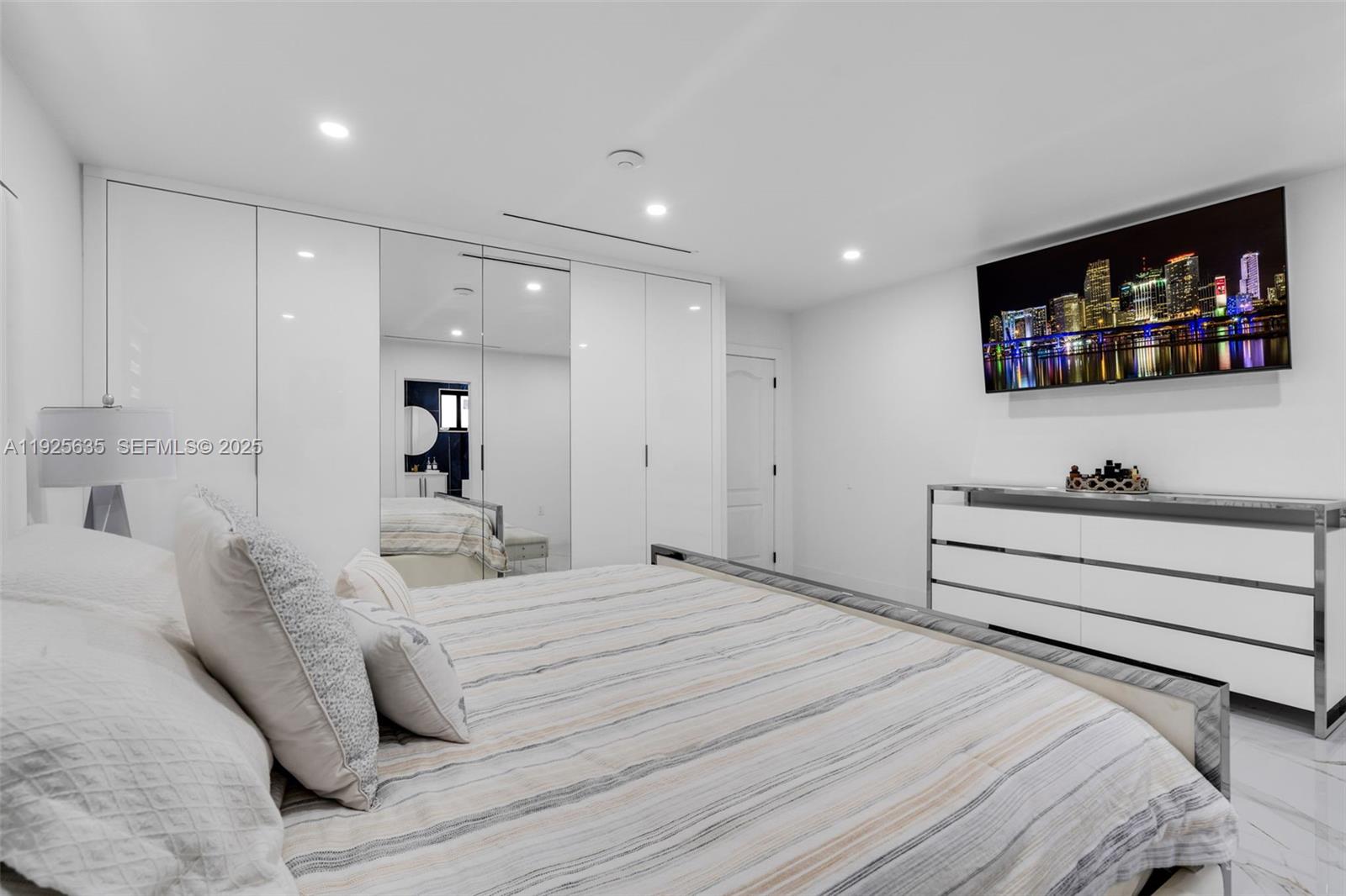 864 West 69th Place Hialeah, FL 33014 - Photo 23 of 45 a bedroom with a bed and a flat screen tv