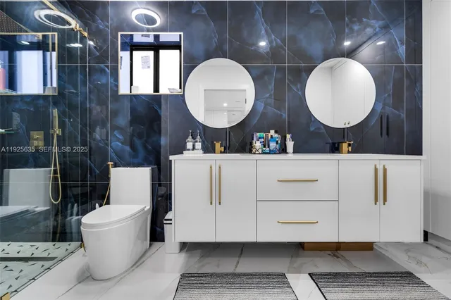 a bathroom with a toilet a sink and mirror