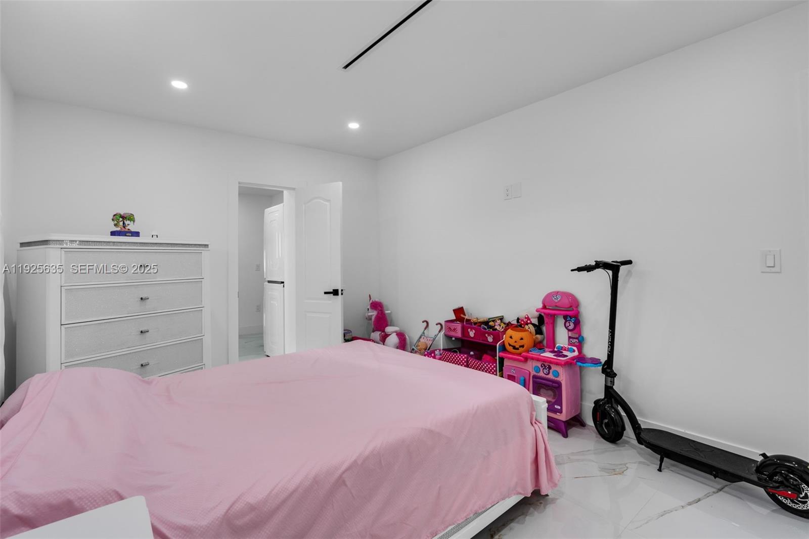 864 West 69th Place Hialeah, FL 33014 - Photo 28 of 45 a bedroom with a bed and a closet