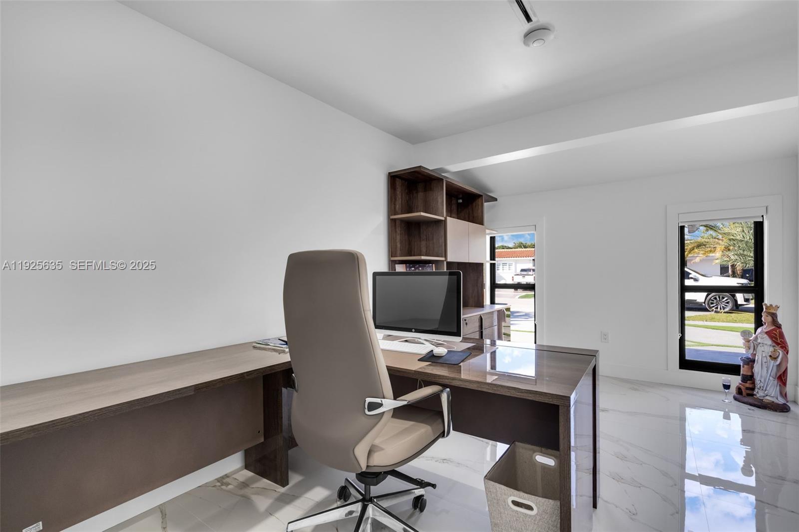 864 West 69th Place Hialeah, FL 33014 - Photo 31 of 45 a view of a workspace with furniture