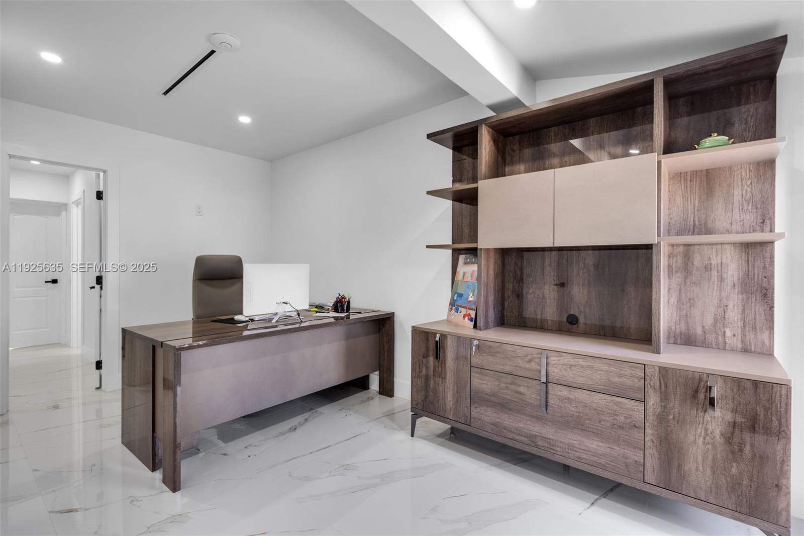 864 West 69th Place Hialeah, FL 33014 - Photo 32 of 45 a room with furniture and a flat screen tv