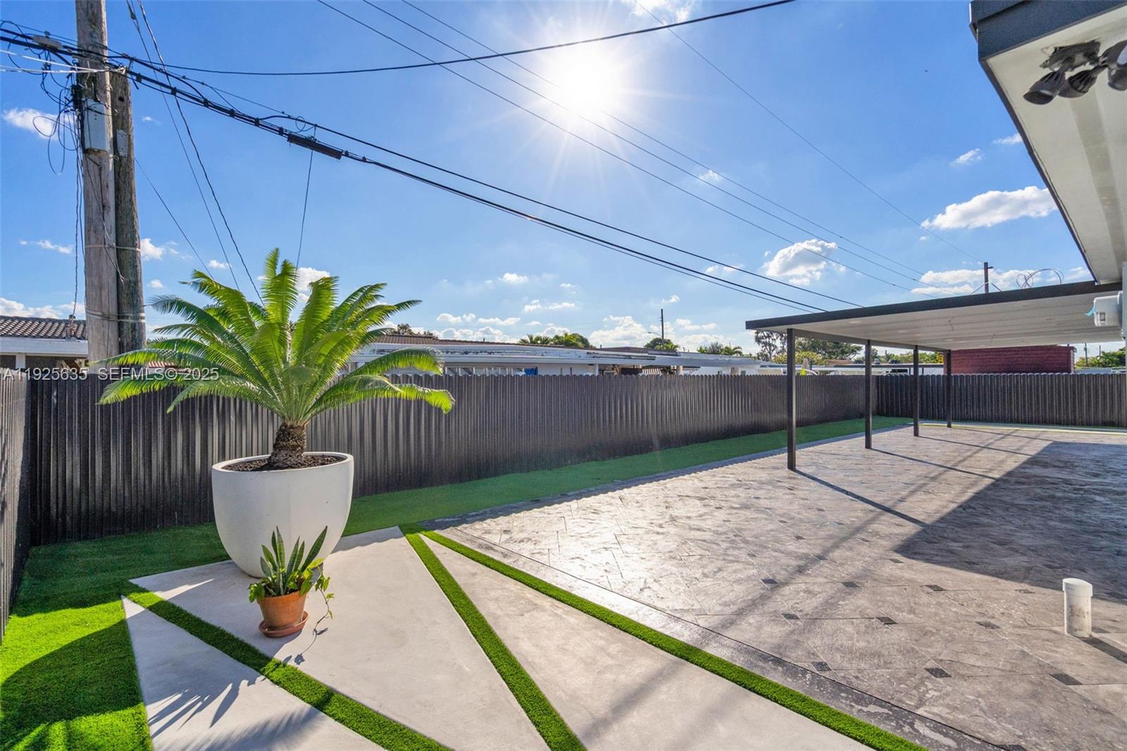 864 West 69th Place Hialeah, FL 33014 - Photo 34 of 45 a view of a terrace with chair and potted plant