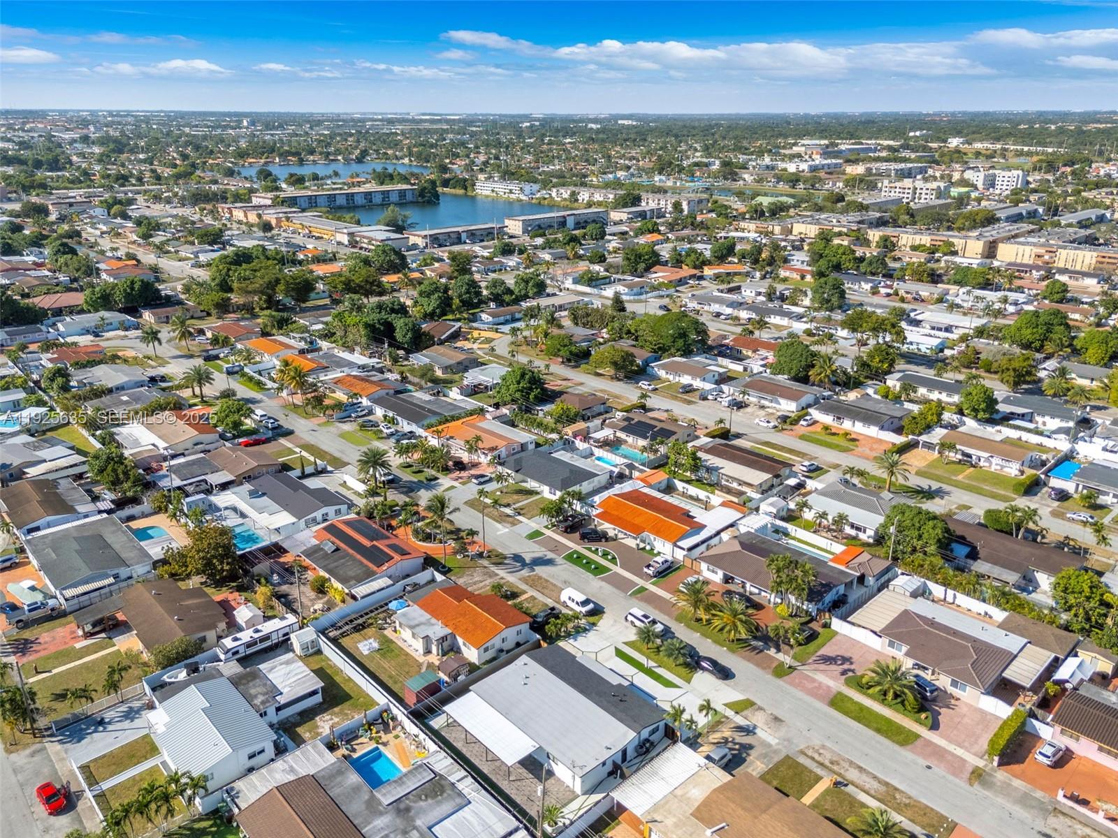 864 West 69th Place Hialeah, FL 33014 - Photo 5 of 45 an aerial view of residential houses with city view