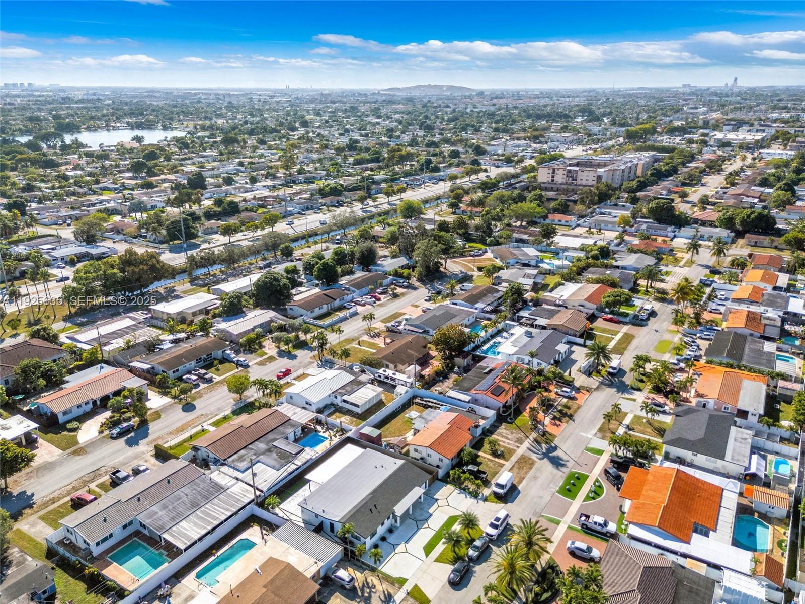 864 West 69th Place Hialeah, FL 33014 - Photo 7 of 45 an aerial view of a city with lots of residential buildings