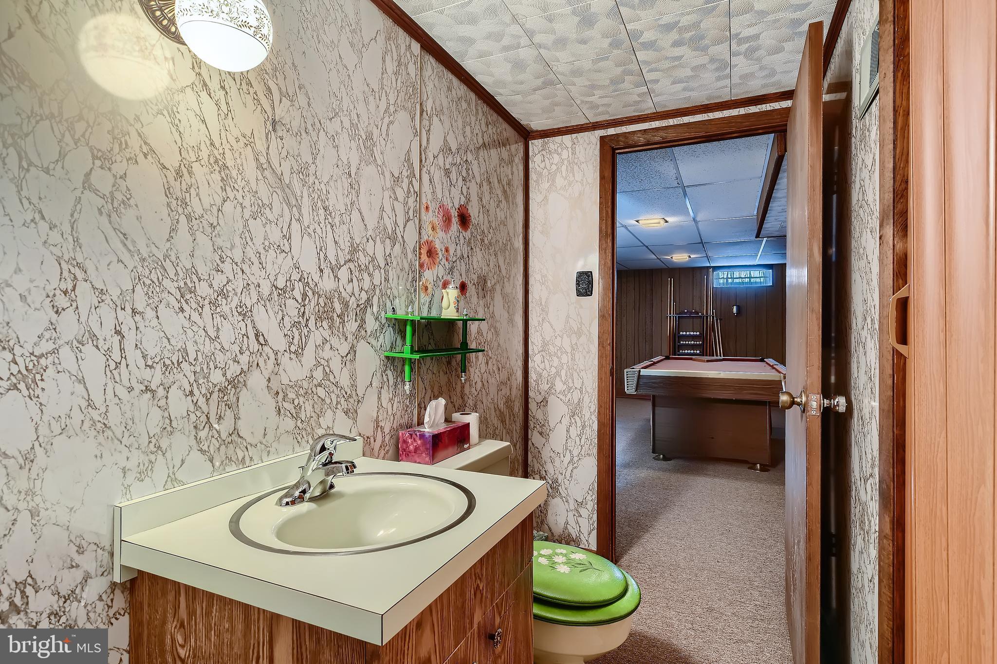 8918 Parlo Road Baltimore, MD 21236 - Photo 18 of 28 a bathroom with a sink vanity mirror and toilet