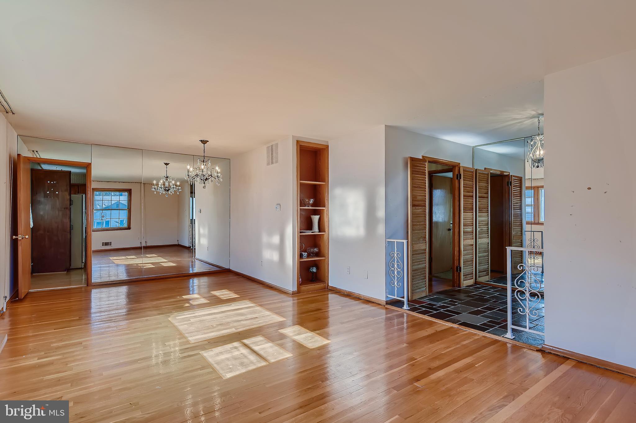8918 Parlo Road Baltimore, MD 21236 - Photo 3 of 28 a view of livingroom with hardwood floor and hallway