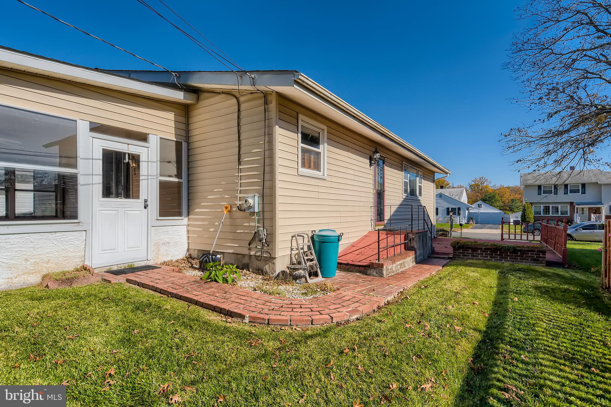 8918 Parlo Road Baltimore, MD 21236 - Photo 28 of 28 a front view of a house with a yard