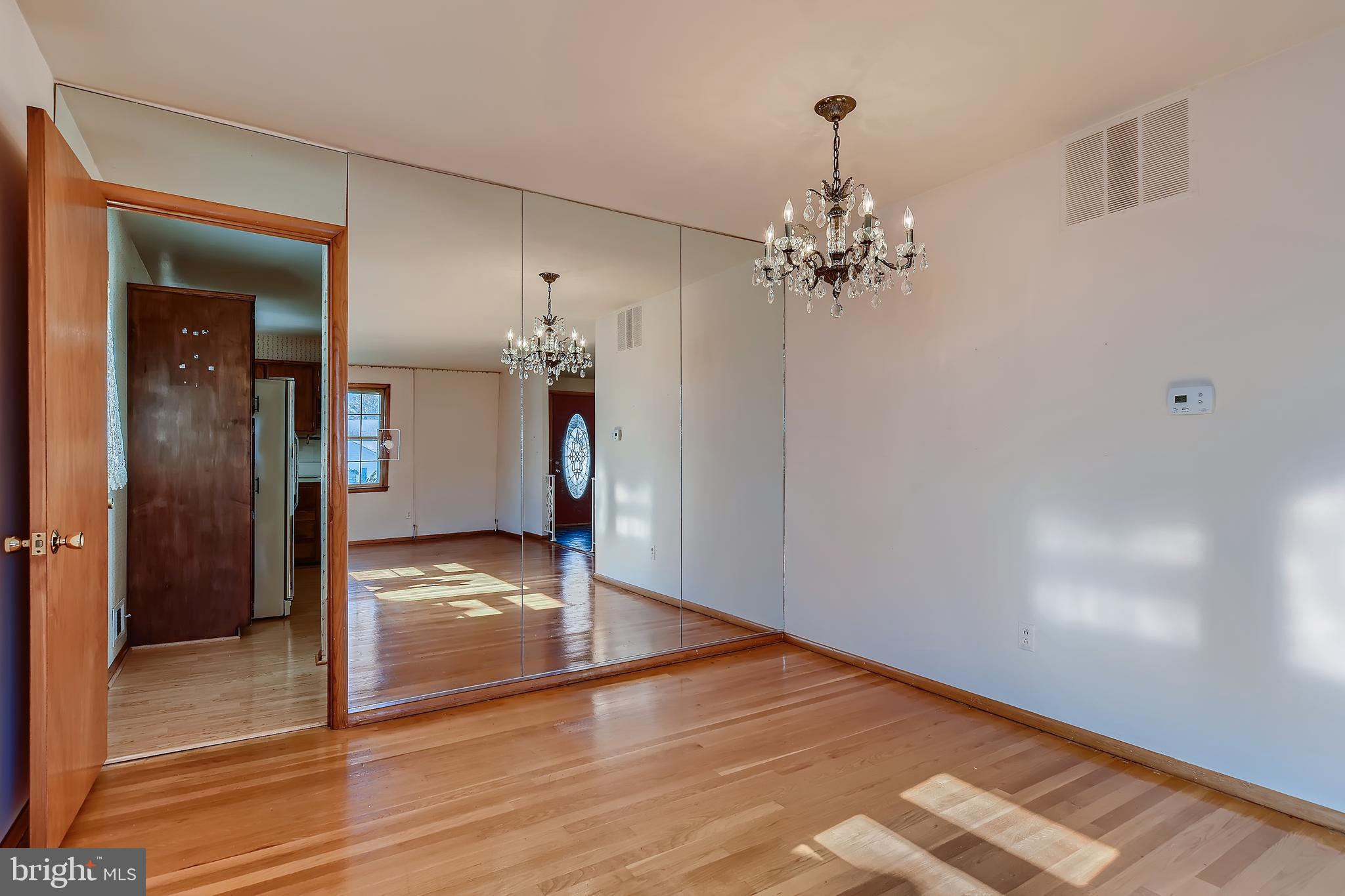 8918 Parlo Road Baltimore, MD 21236 - Photo 5 of 28 a view of a chandelier in a room
