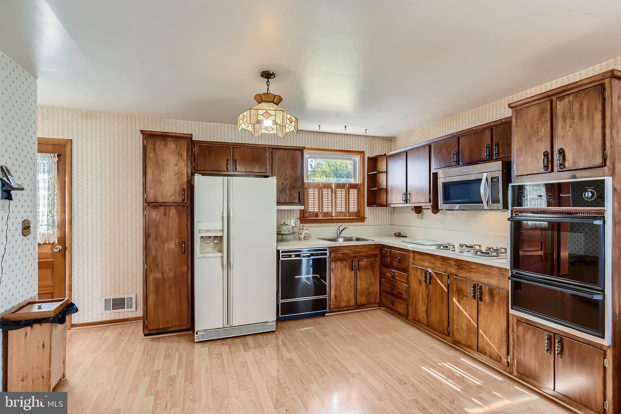 8918 Parlo Road Baltimore, MD 21236 - Photo 8 of 28 a kitchen with stainless steel appliances granite countertop a refrigerator and a stove top oven