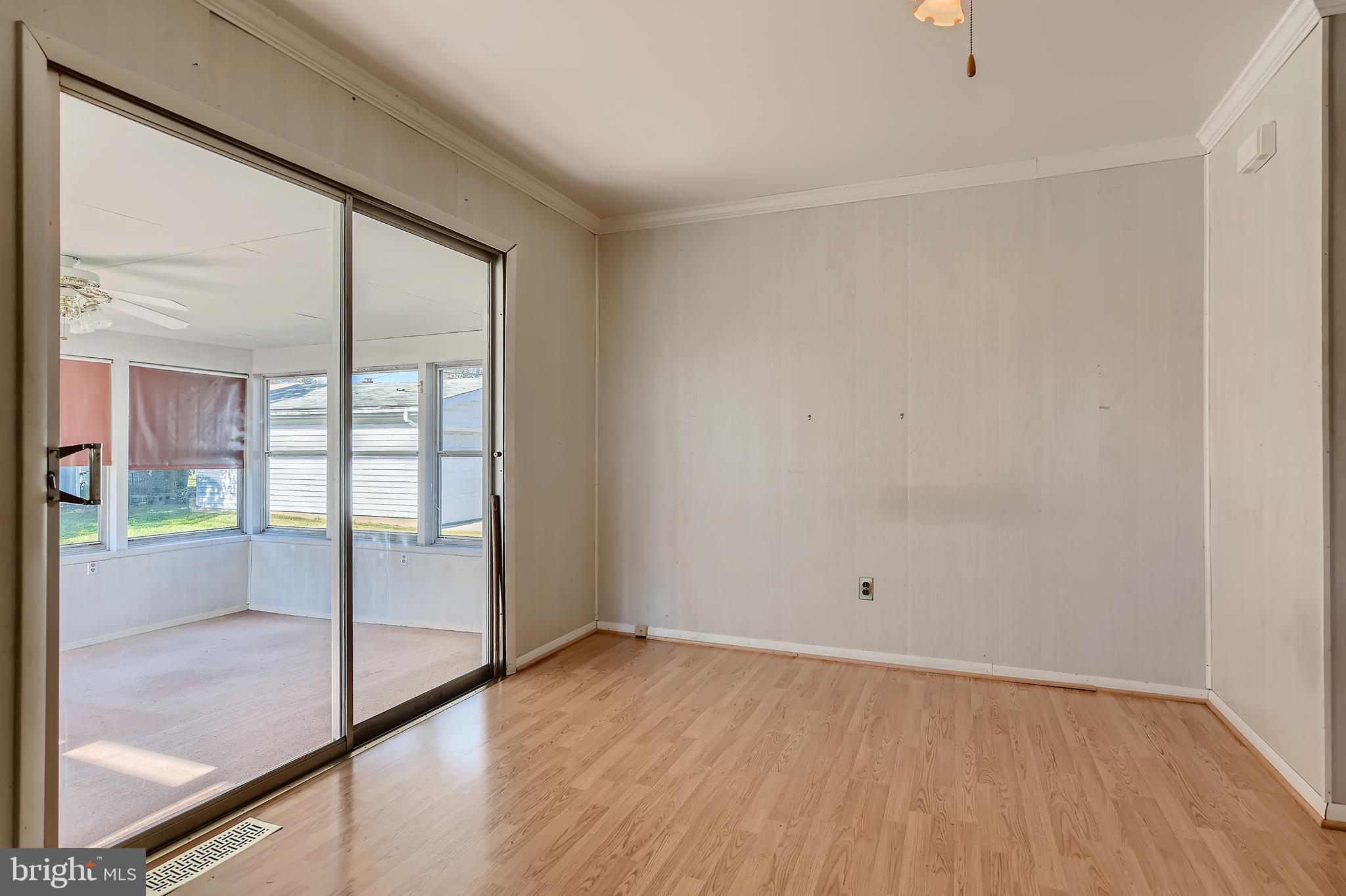 8918 Parlo Road Baltimore, MD 21236 - Photo 9 of 28 a view of empty room with wooden floor