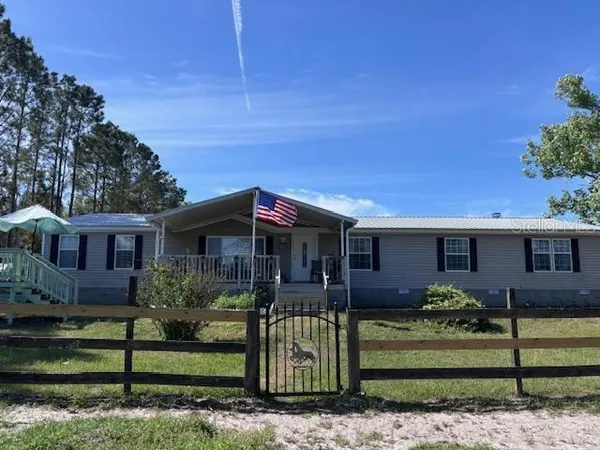 front view of a house with a small yard