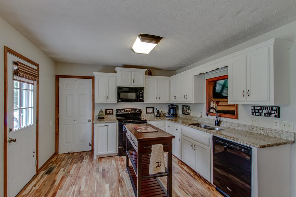 4002 Harding Place Springfield, TN 37172 - Photo 6 of 17 a kitchen with a stove a sink and a refrigerator