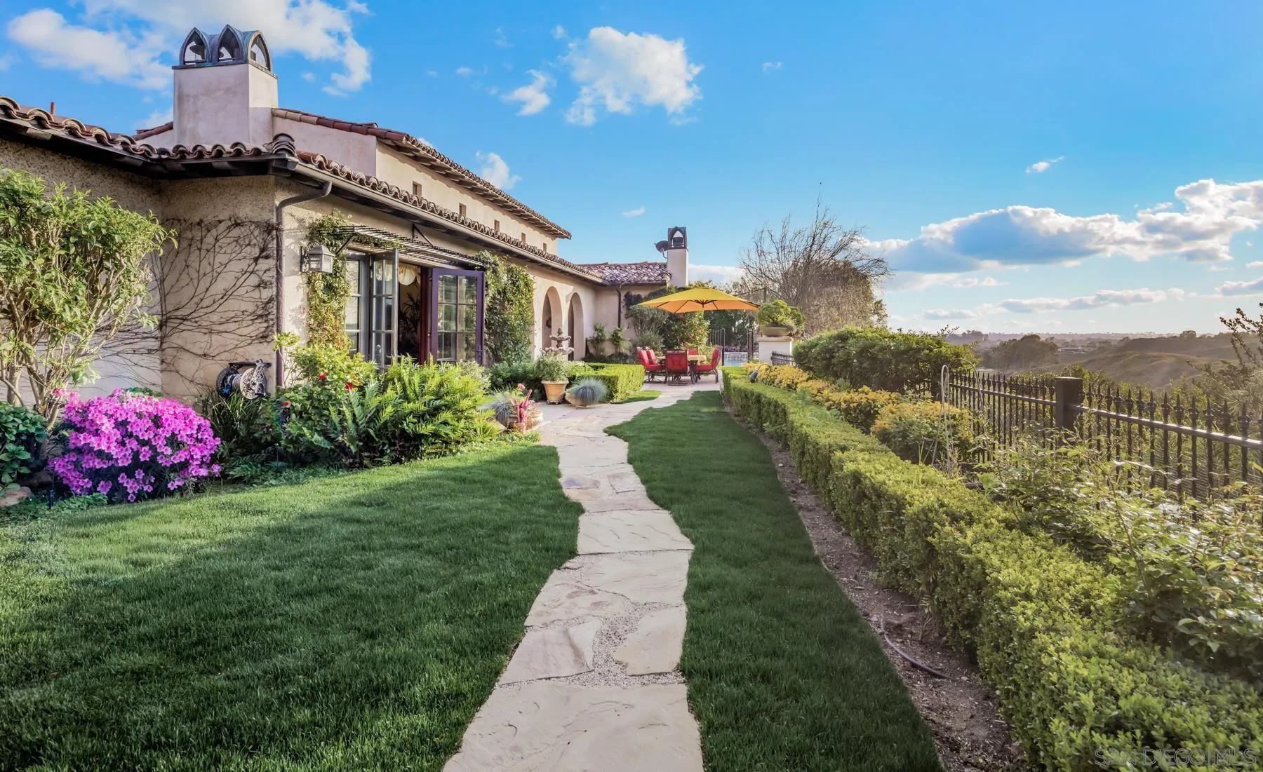 18669 Via Catania Rancho Santa Fe, CA 92091 - Photo 17 of 39 a view of a house with a garden and pathway