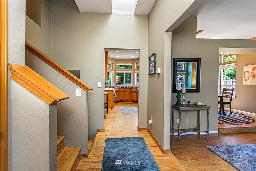 19602 9th Drive Southeast Bothell, WA 98012 - Photo 2 of 20 a hallway with wooden floor and furniture