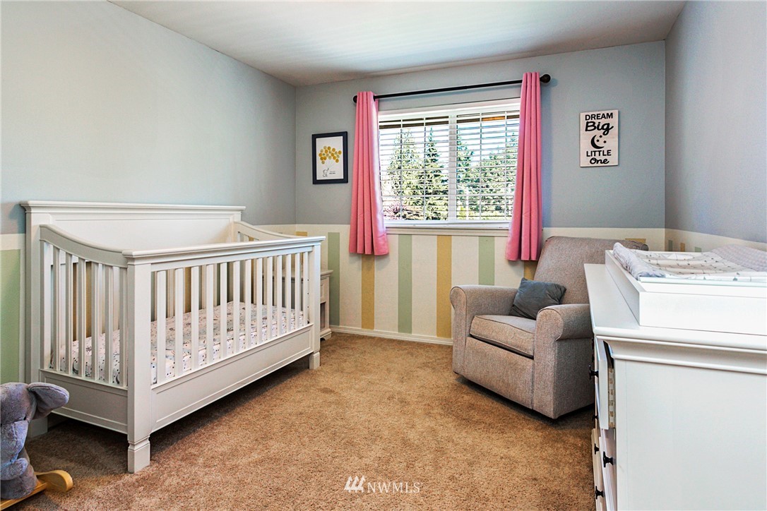 19602 9th Drive Southeast Bothell, WA 98012 - Photo 14 of 20 a bedroom with furniture and a window