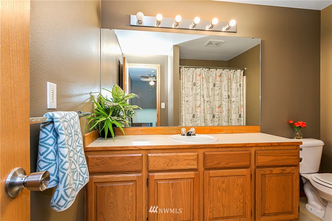19602 9th Drive Southeast Bothell, WA 98012 - Photo 16 of 20 a room with a sink and a mirror
