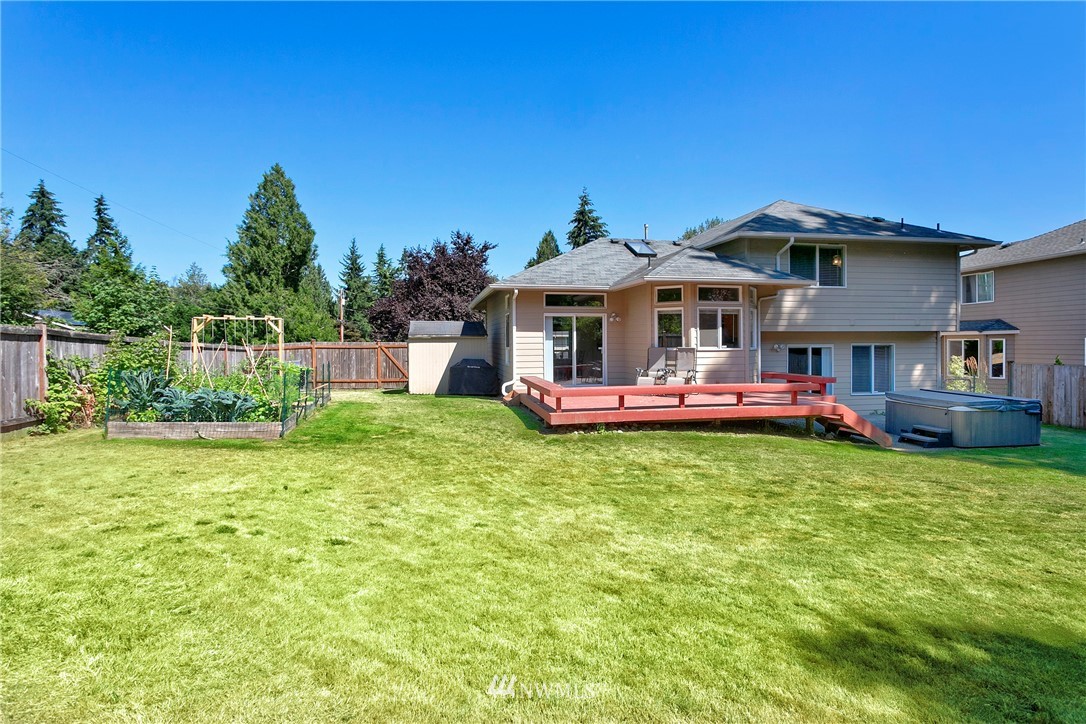 19602 9th Drive Southeast Bothell, WA 98012 - Photo 19 of 20 a front view of a house with a yard table and chairs
